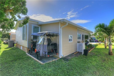 2022 Model home features accordion hurricane shutters, double on Barefoot Bay Golf Course in Florida - for sale on GolfHomes.com, golf home, golf lot