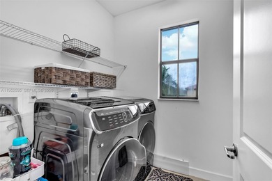 Gorgeous two-story single-family home built in 2019, located in on Woodlands Country Club in Florida - for sale on GolfHomes.com, golf home, golf lot