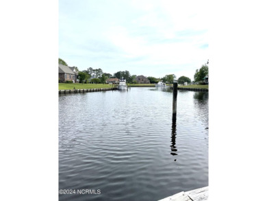 Boating enthusiasts rejoice! With deep water access just steps on Harbour Point Golf Club in North Carolina - for sale on GolfHomes.com, golf home, golf lot