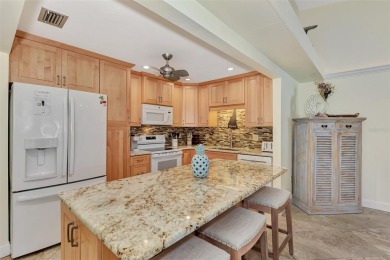 This completely remodeled end-unit villa at Fairways of Capri is on Capri Isle Golf Club in Florida - for sale on GolfHomes.com, golf home, golf lot