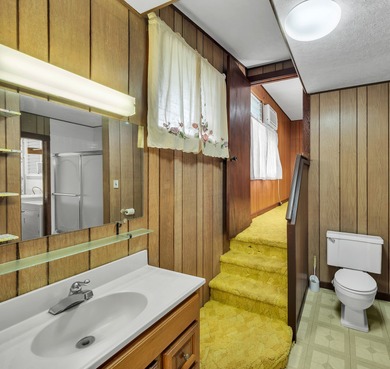 This spacious, classic midcentury Hilo home has been in the same on Hilo Municipal Golf Course in Hawaii - for sale on GolfHomes.com, golf home, golf lot