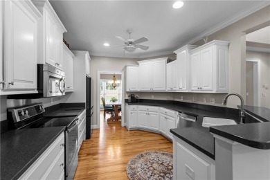 Step into a home that exudes warmth, sophistication, and on Cobbs Glen Country Club in South Carolina - for sale on GolfHomes.com, golf home, golf lot