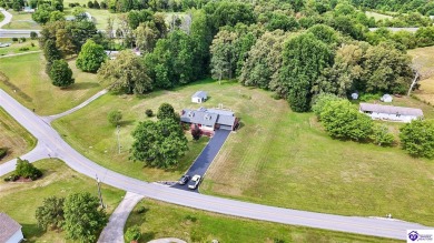 Welcome to this stunning brick home with modern amenities on 4.4 on Elizabethtown Country Club in Kentucky - for sale on GolfHomes.com, golf home, golf lot