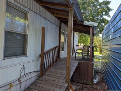 Enjoy a reasonably priced lake home in popular Arrowhead Estates on Arrowhead State Park Golf Course in Oklahoma - for sale on GolfHomes.com, golf home, golf lot