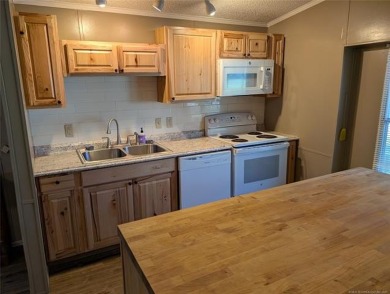 Enjoy a reasonably priced lake home in popular Arrowhead Estates on Arrowhead State Park Golf Course in Oklahoma - for sale on GolfHomes.com, golf home, golf lot