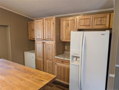 Enjoy a reasonably priced lake home in popular Arrowhead Estates on Arrowhead State Park Golf Course in Oklahoma - for sale on GolfHomes.com, golf home, golf lot