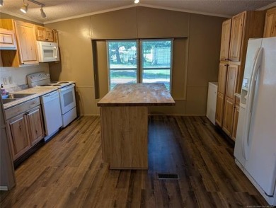 Enjoy a reasonably priced lake home in popular Arrowhead Estates on Arrowhead State Park Golf Course in Oklahoma - for sale on GolfHomes.com, golf home, golf lot