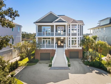 Enjoy breathtaking panoramic views of the marsh, estuary, and on DeBordieu Country Club in South Carolina - for sale on GolfHomes.com, golf home, golf lot