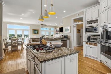 Enjoy breathtaking panoramic views of the marsh, estuary, and on DeBordieu Country Club in South Carolina - for sale on GolfHomes.com, golf home, golf lot
