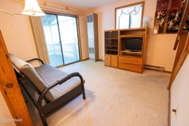 Classic Pocono Lake chalet with endless potential! This on The Hideout Golf in Pennsylvania - for sale on GolfHomes.com, golf home, golf lot