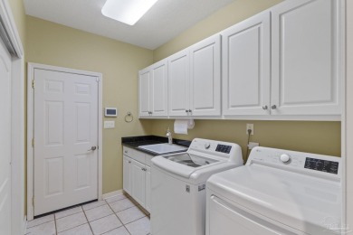 Luxury meets lifestyle in this stunning 3 bed, 3 bath, two-story on Tiger Point Golf and Country Club in Florida - for sale on GolfHomes.com, golf home, golf lot