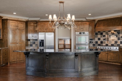This 4 bed, 3.5 bath home is located in the San Poppi on Millwood Golf and Racquet Club in Missouri - for sale on GolfHomes.com, golf home, golf lot