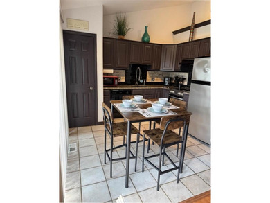 Wake up to lake views and easy living on Table Rock Lake. This on Holiday Island Executive Golf Course in Arkansas - for sale on GolfHomes.com, golf home, golf lot