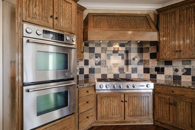 This 4 bed, 3.5 bath home is located in the San Poppi on Millwood Golf and Racquet Club in Missouri - for sale on GolfHomes.com, golf home, golf lot