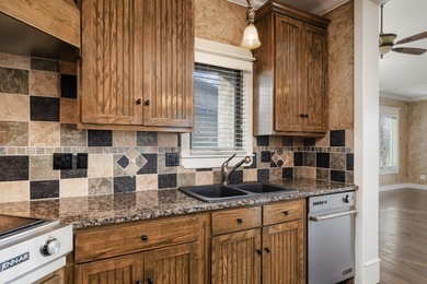 This 4 bed, 3.5 bath home is located in the San Poppi on Millwood Golf and Racquet Club in Missouri - for sale on GolfHomes.com, golf home, golf lot