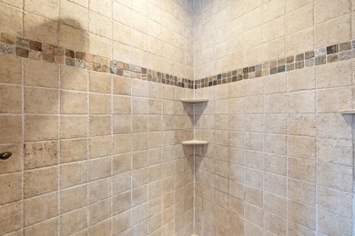 This 4 bed, 3.5 bath home is located in the San Poppi on Millwood Golf and Racquet Club in Missouri - for sale on GolfHomes.com, golf home, golf lot