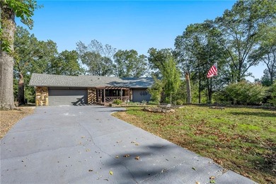 Welcome to this delightful ranch-style home, where stone accents on Bella Vista Country Club - Berksdale in Arkansas - for sale on GolfHomes.com, golf home, golf lot