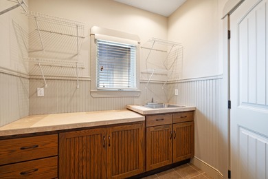 This 4 bed, 3.5 bath home is located in the San Poppi on Millwood Golf and Racquet Club in Missouri - for sale on GolfHomes.com, golf home, golf lot