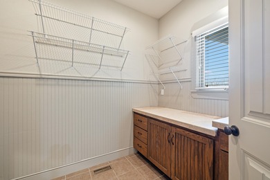 This 4 bed, 3.5 bath home is located in the San Poppi on Millwood Golf and Racquet Club in Missouri - for sale on GolfHomes.com, golf home, golf lot