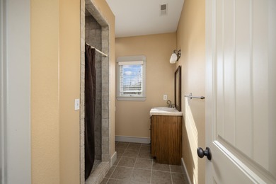 This 4 bed, 3.5 bath home is located in the San Poppi on Millwood Golf and Racquet Club in Missouri - for sale on GolfHomes.com, golf home, golf lot