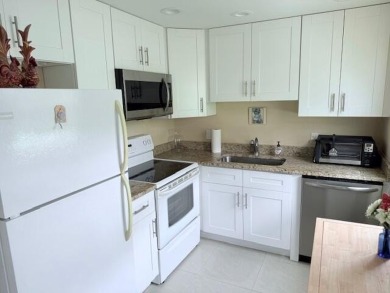 Very desirable 1st floor corner unit with newer kitchen (shaker on Hillsboro Pines Golf in Florida - for sale on GolfHomes.com, golf home, golf lot