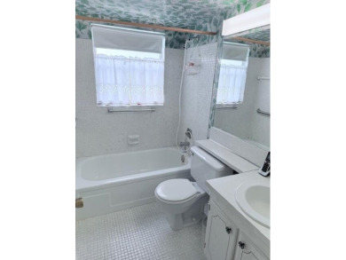 Very desirable 1st floor corner unit with newer kitchen (shaker on Hillsboro Pines Golf in Florida - for sale on GolfHomes.com, golf home, golf lot