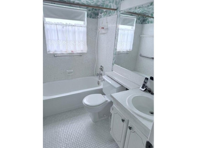 Very desirable 1st floor corner unit with newer kitchen (shaker on Hillsboro Pines Golf in Florida - for sale on GolfHomes.com, golf home, golf lot