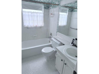 Very desirable 1st floor corner unit with newer kitchen (shaker on Hillsboro Pines Golf in Florida - for sale on GolfHomes.com, golf home, golf lot