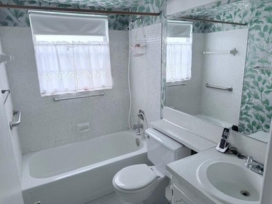 Very desirable 1st floor corner unit with newer kitchen (shaker on Hillsboro Pines Golf in Florida - for sale on GolfHomes.com, golf home, golf lot