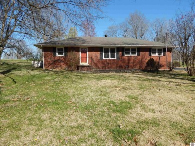Three bedroom, two bath brick home sitting on a 1.26 acre corner on Calvert City Golf and Country Club in Kentucky - for sale on GolfHomes.com, golf home, golf lot