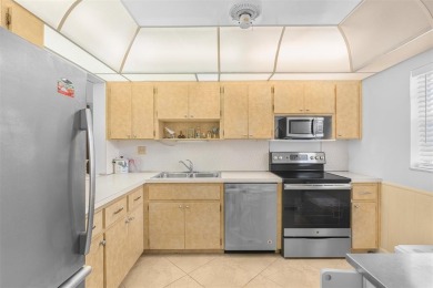Welcome to this beautifully maintained first-floor condo with a on Cooper Colony Country Club in Florida - for sale on GolfHomes.com, golf home, golf lot