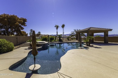 This home is located at the end of a private cul-de-sac in the on London Bridge Golf Course in Arizona - for sale on GolfHomes.com, golf home, golf lot