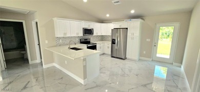 BRAND NEW CONSTRUCTION 3-bedroom, 2-bathroom home with a 1-car on Mirror Lakes Golf Club in Florida - for sale on GolfHomes.com, golf home, golf lot