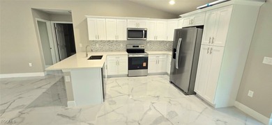 BRAND NEW CONSTRUCTION 3-bedroom, 2-bathroom home with a 1-car on Mirror Lakes Golf Club in Florida - for sale on GolfHomes.com, golf home, golf lot