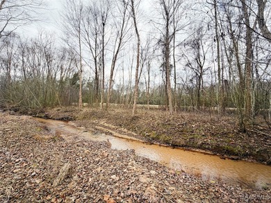 Located on the golf course in Emerald Mountain with flowing on Emerald Mountain Golf Course in Alabama - for sale on GolfHomes.com, golf home, golf lot