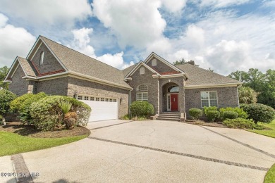 Proudly presenting this low-maintenance brick home located on on Ocean Ridge Plantation in North Carolina - for sale on GolfHomes.com, golf home, golf lot