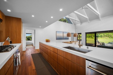 Modern Hawaiian Plantation style residence completed in 2022 and on Kiahuna Golf Club in Hawaii - for sale on GolfHomes.com, golf home, golf lot