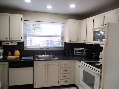 BEAUTIFUL, VERY SPACIOUS CORNER UNIT OFFERING ABUNDANT NATURAL on Sunrise Lakes Phase III in Florida - for sale on GolfHomes.com, golf home, golf lot