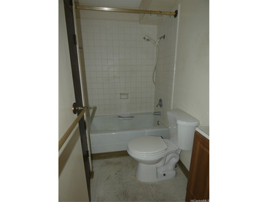 Conveniently located in Waikiki...unit has an enclosed lanai for on Ala Wai Golf Course in Hawaii - for sale on GolfHomes.com, golf home, golf lot