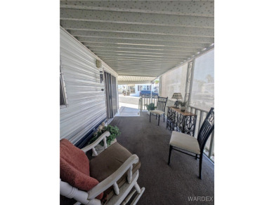 Perfect snowbird retreat. The enclosed patio offers extra room on Riverview Golf Course in Arizona - for sale on GolfHomes.com, golf home, golf lot