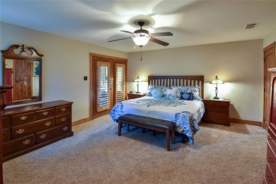 Step into luxury and warmth of this breathtaking three-bedroom on Holly Lake Ranch Golf Club in Texas - for sale on GolfHomes.com, golf home, golf lot
