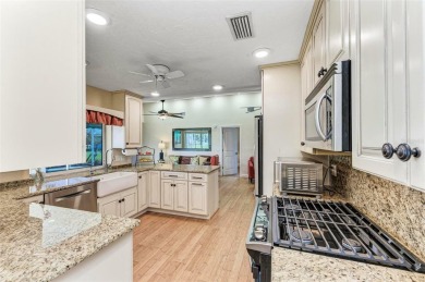 Beautifully updated 3 bedroom, 2 bathroom pool home with dock on on Saint Andrews South Golf Club in Florida - for sale on GolfHomes.com, golf home, golf lot