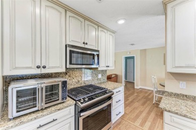 Beautifully updated 3 bedroom, 2 bathroom pool home with dock on on Saint Andrews South Golf Club in Florida - for sale on GolfHomes.com, golf home, golf lot