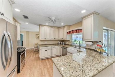 Beautifully updated 3 bedroom, 2 bathroom pool home with dock on on Saint Andrews South Golf Club in Florida - for sale on GolfHomes.com, golf home, golf lot