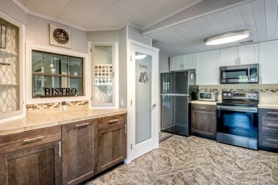 This unique two-bedroom, two-bath home in the gated, golf-course on Lake Fairways Country Club in Florida - for sale on GolfHomes.com, golf home, golf lot