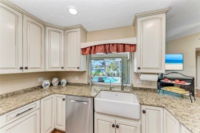 Beautifully updated 3 bedroom, 2 bathroom pool home with dock on on Saint Andrews South Golf Club in Florida - for sale on GolfHomes.com, golf home, golf lot