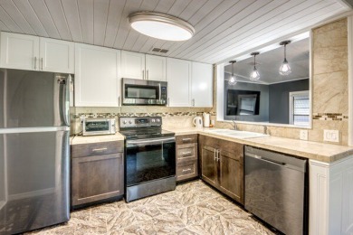 This unique two-bedroom, two-bath home in the gated, golf-course on Lake Fairways Country Club in Florida - for sale on GolfHomes.com, golf home, golf lot