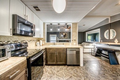 This unique two-bedroom, two-bath home in the gated, golf-course on Lake Fairways Country Club in Florida - for sale on GolfHomes.com, golf home, golf lot