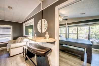 This unique two-bedroom, two-bath home in the gated, golf-course on Lake Fairways Country Club in Florida - for sale on GolfHomes.com, golf home, golf lot