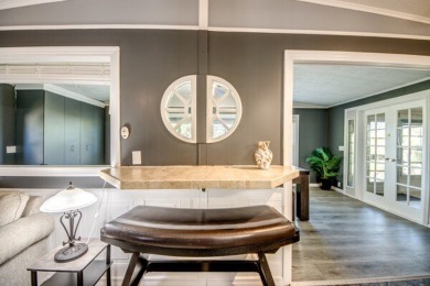 This unique two-bedroom, two-bath home in the gated, golf-course on Lake Fairways Country Club in Florida - for sale on GolfHomes.com, golf home, golf lot